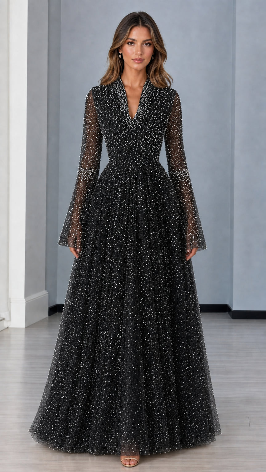 Front view of black pearl-embellished long sleeve formal evening gown