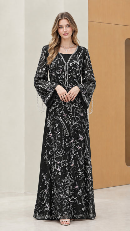 Model wearing Black floral embroidered sequin evening maxi dress with beaded bell sleeves