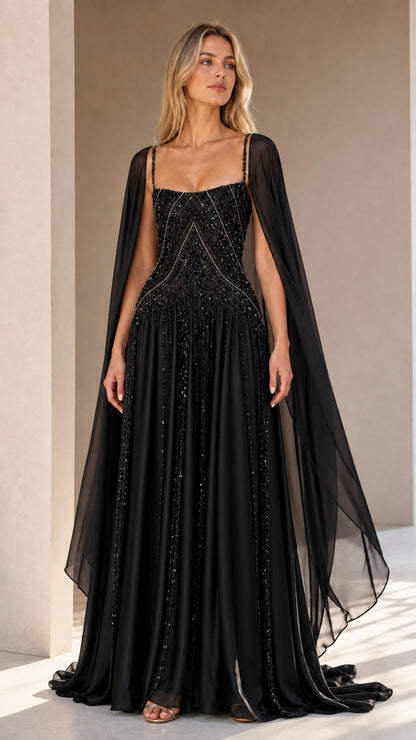 Front view of black beaded cape sleeve evening gown