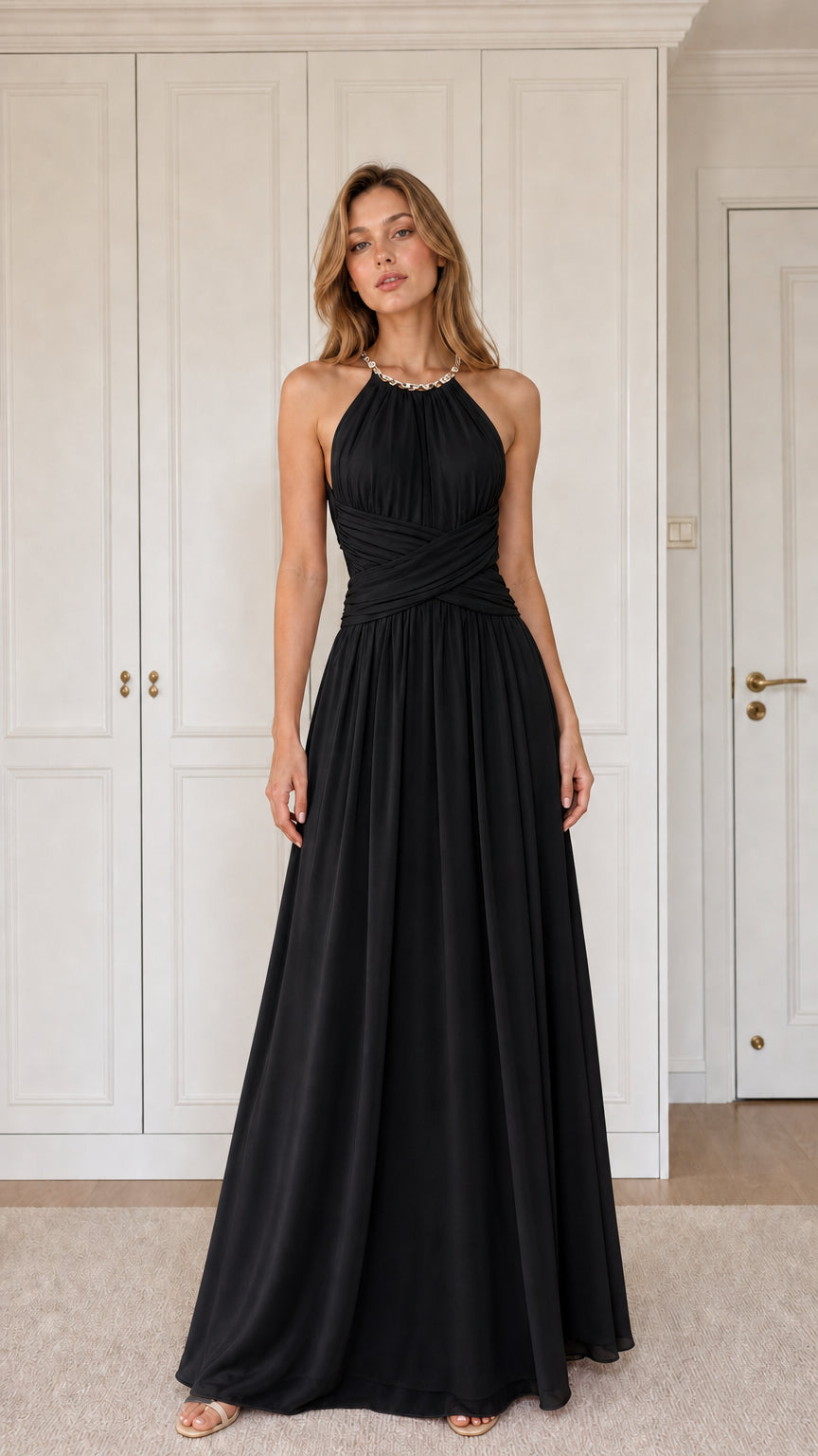 Front view of woman wearing black halter pleated chiffon maxi evening gown