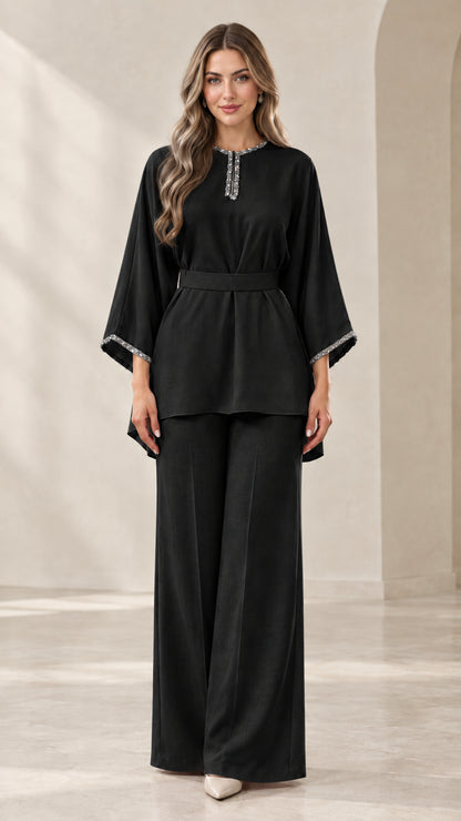 Full-length front view of black rhinestone-embellished tunic top and wide-leg pants set