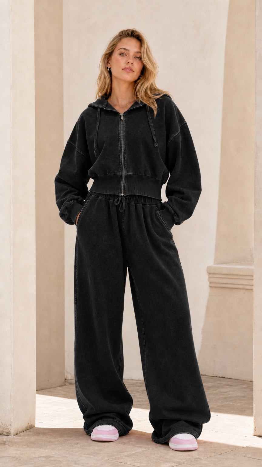 Full front view of model wearing washed black cropped zip hoodie and wide leg sweatpants set