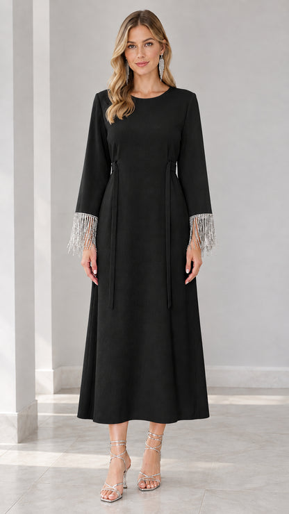 Front view of black long sleeve maxi dress with crystal fringe sleeves