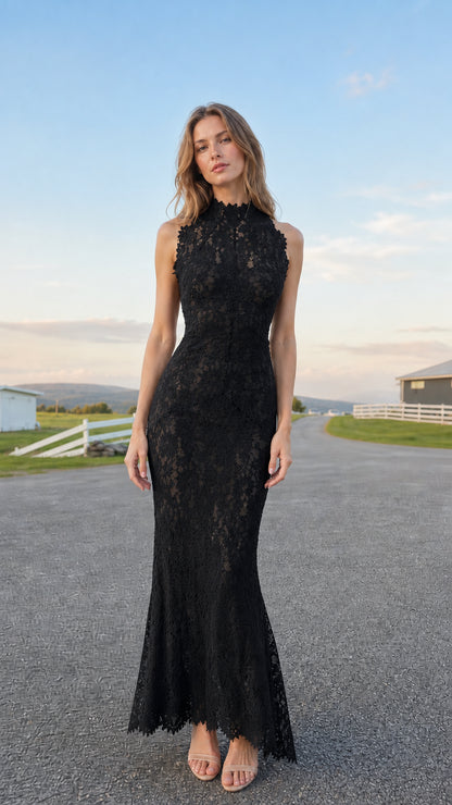 Model wearing black sleeveless high neck floral lace maxi formal dress