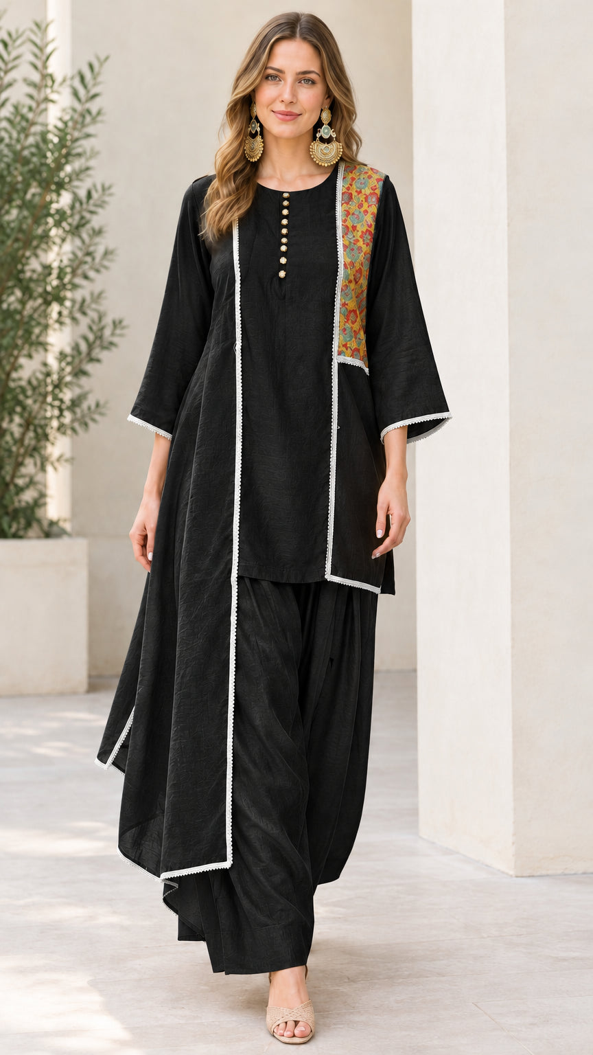 Woman wearing Black asymmetrical kurta and dhoti pant set