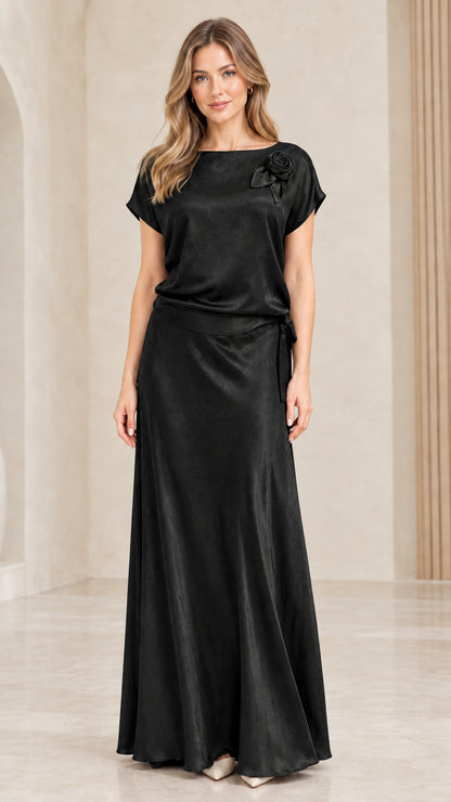 Full-length front view of woman wearing Black satin evening maxi gown