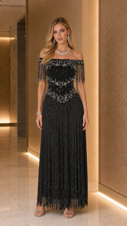 Model wearing Black off-the-shoulder beaded fringe maxi evening gown