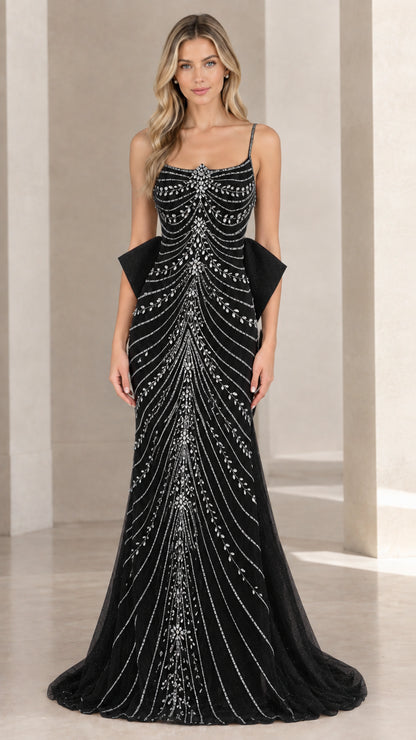 Front view of black beaded spaghetti strap formal gown with back bow accent
