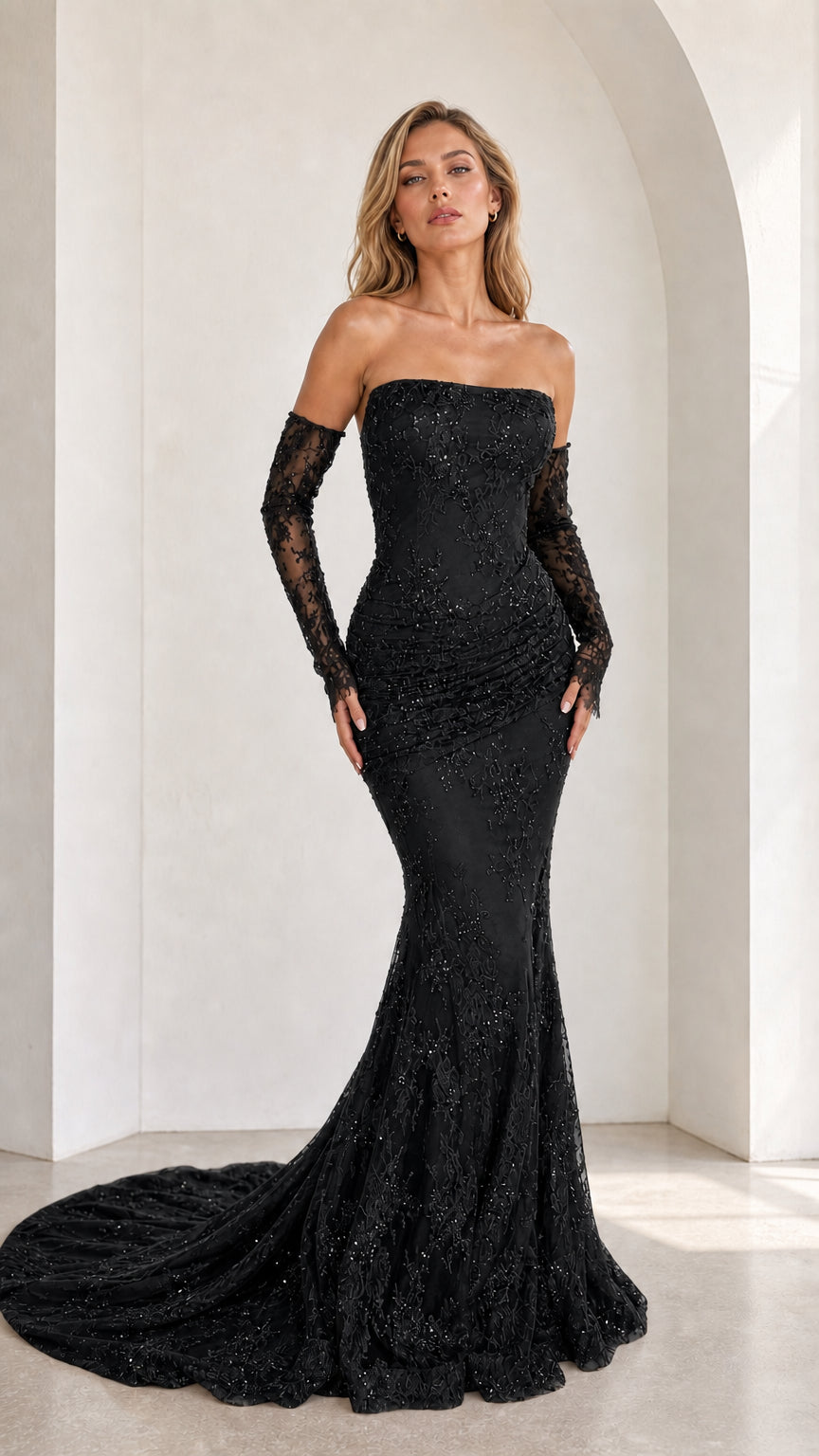 Black strapless beaded lace mermaid gown with sheer sleeves