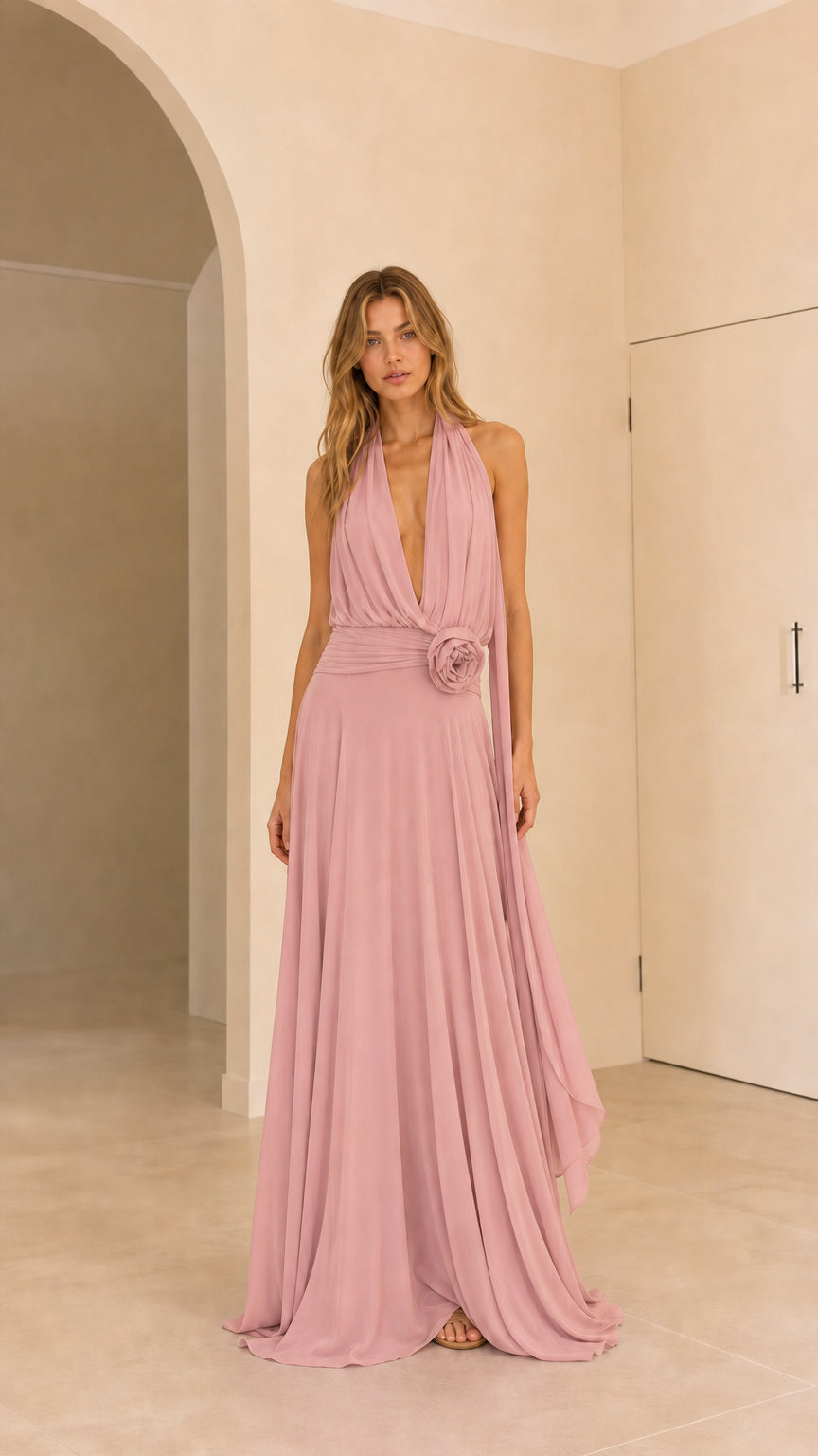 Full front view of dusty pink halter pleated formal evening gown