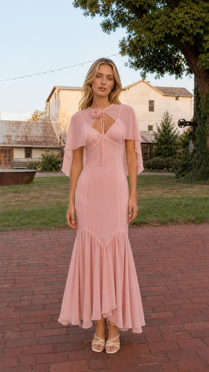 Front view of model wearing Dusty Pink floral rosette capelet mermaid maxi dress
