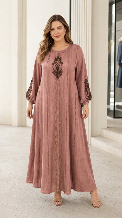 Woman wearing dusty rose pink beaded embroidery maxi dress
