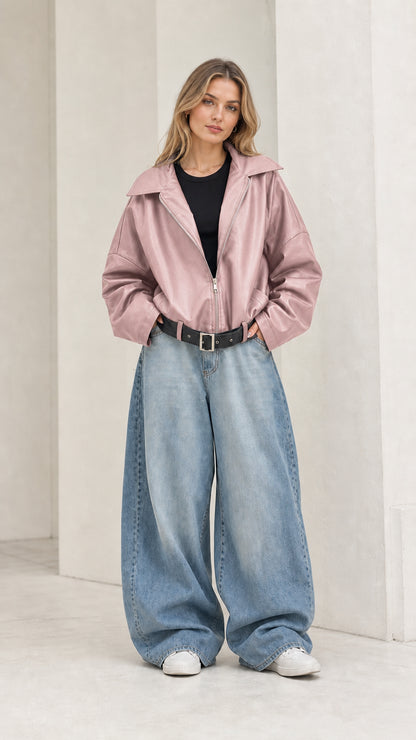 Full front view of model wearing dusty pink oversized faux leather jacket