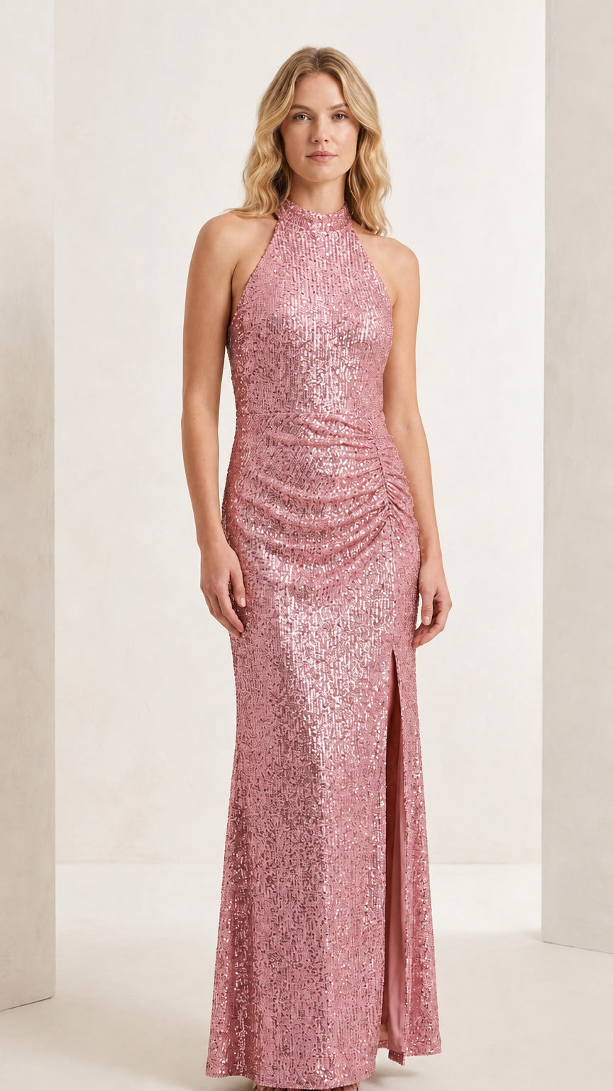 Front full-length view of model wearing the blush pink halter sequin evening maxi gown
