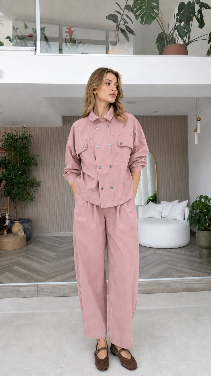 Model wearing dusty pink double-breasted shirt and wide-leg trousers set