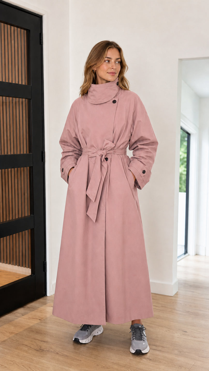 Front full-length view of dusty pink high neck maxi trench coat