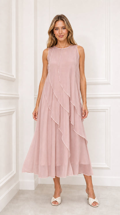 Model wearing dusty pink sleeveless cascading ruffle midi dress
