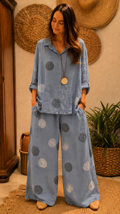 Dusty blue polka dot two-piece outfit with collared long sleeve shirt and wide leg pants