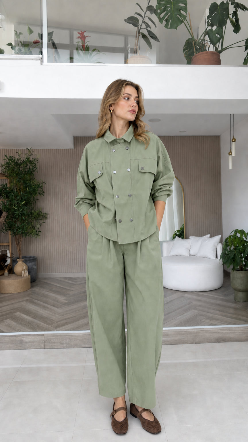 Model wearing sage green double-breasted long sleeve matching pant set