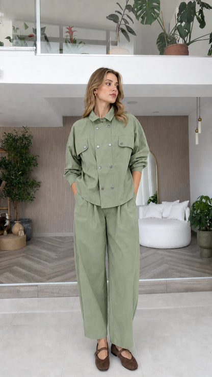 Model wearing sage green double-breasted long sleeve matching pant set