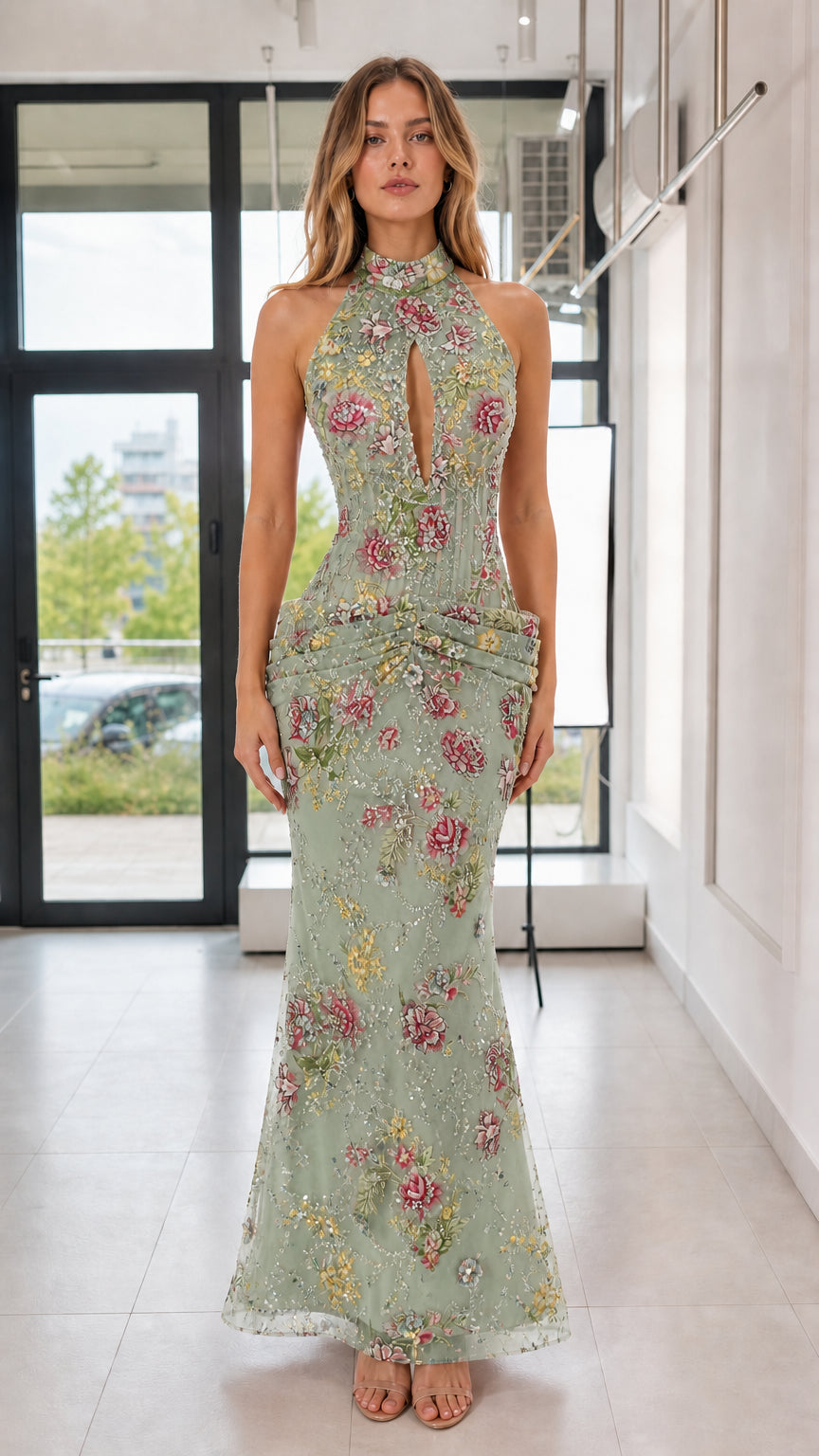 Model wearing sage green floral sequin evening gown