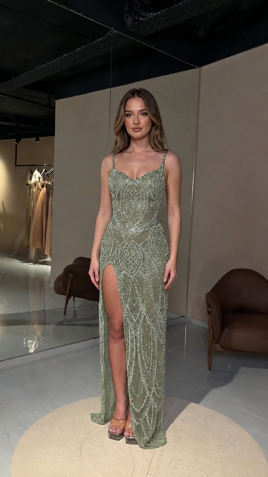 Front view of sage green beaded high slit formal maxi dress