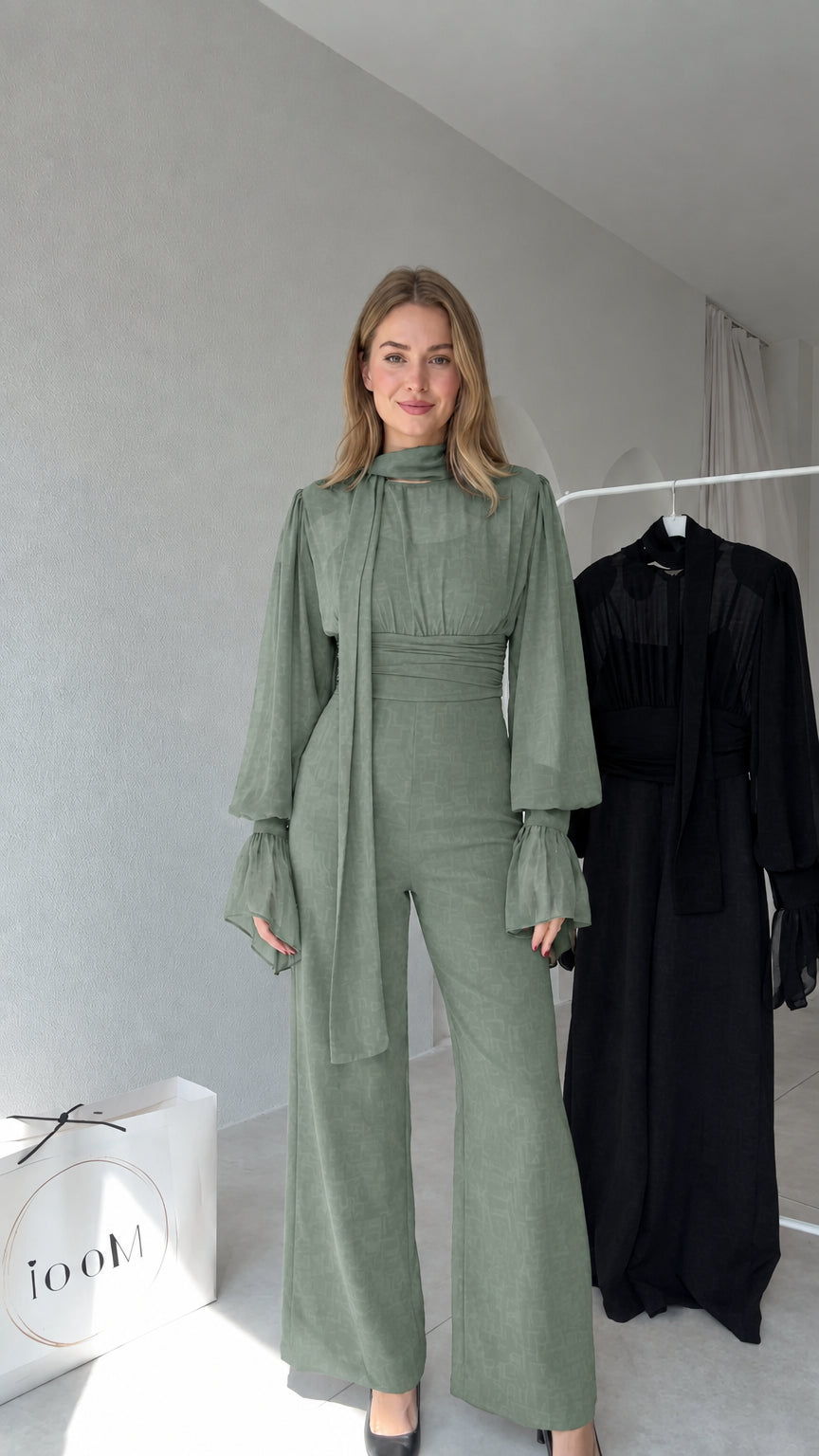 Full front view of model wearing Sage Green tie-neck wide-leg jumpsuit
