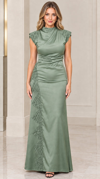 Front view of woman wearing sage green satin evening dress with cowl mock neck