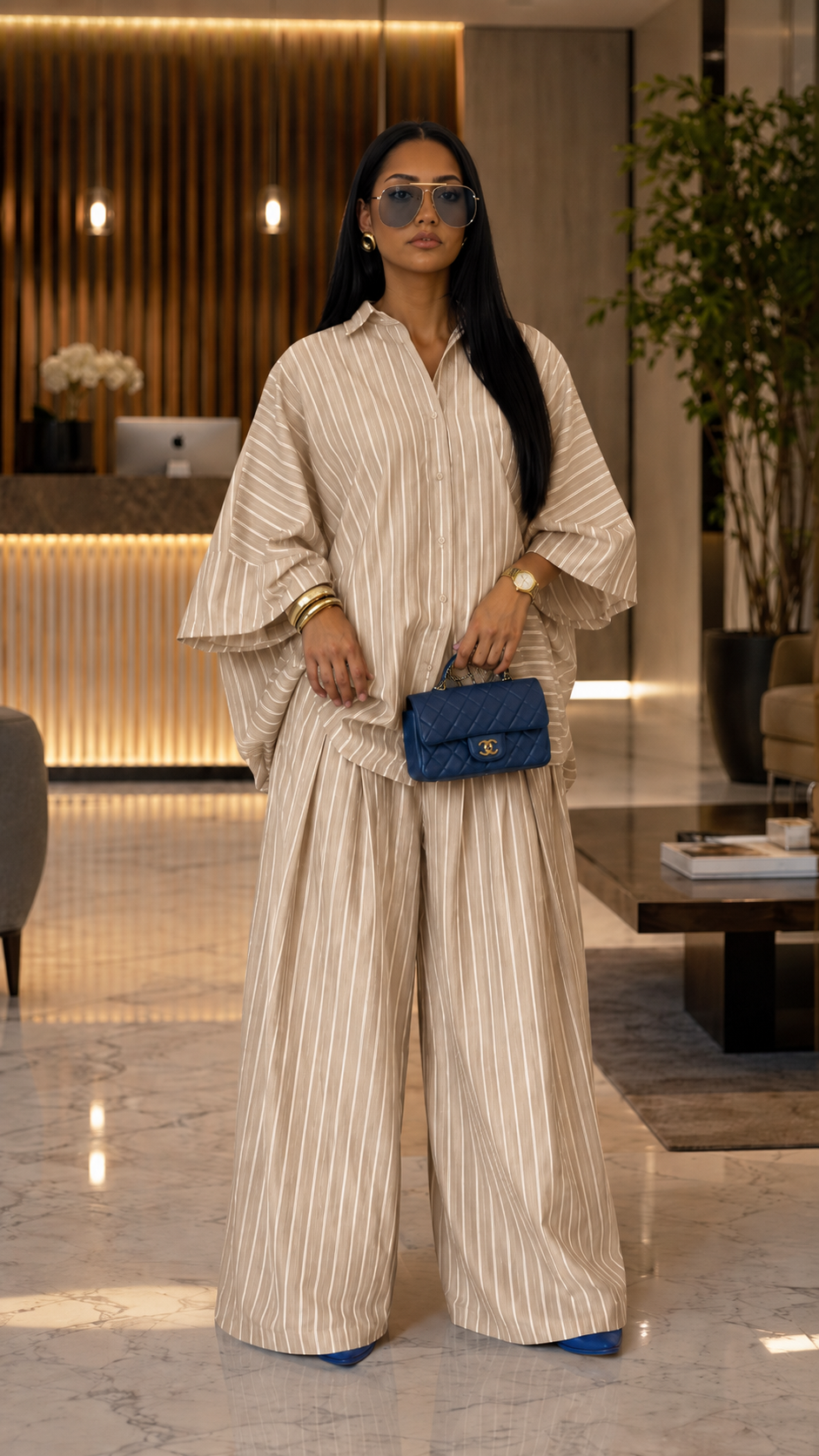 Front view of beige striped oversized shirt and wide leg pants set