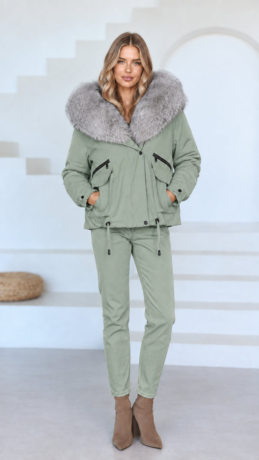 Front view of model wearing sage green faux fur hooded jacket and matching green pants