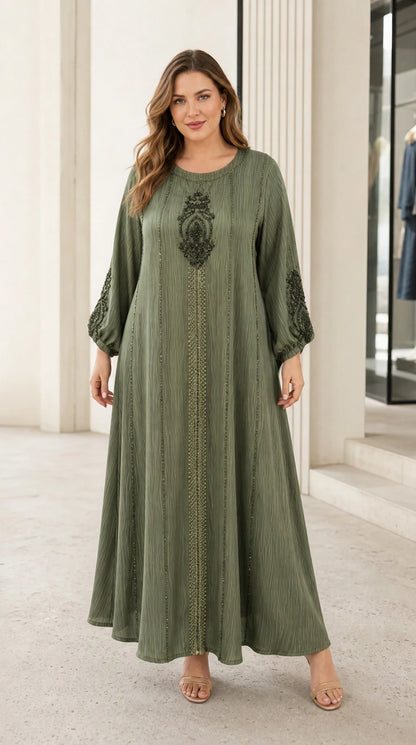 Woman wearing sage green long sleeve embroidered kaftan maxi dress