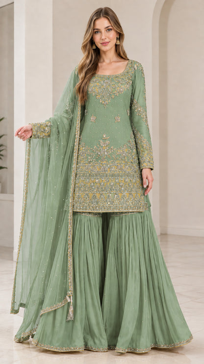 Full-length view of woman wearing Sage Green festive embroidered sharara suit set