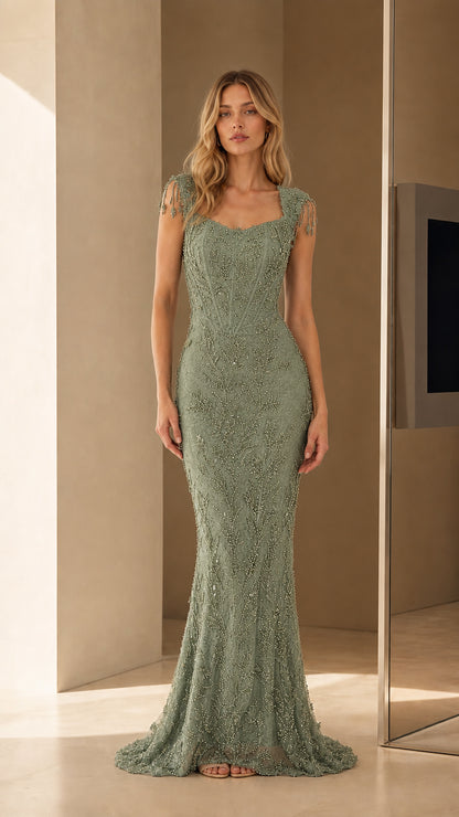 Model wearing Sage Green beaded evening gown