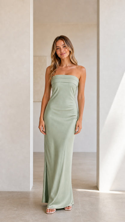 Front view of model wearing a sage green strapless satin maxi dress