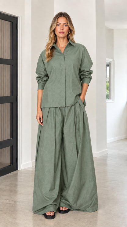 Sage green two-piece outfit with collared long-sleeve top and voluminous palazzo pants
