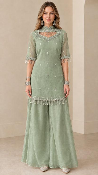 Front view of sage green embroidered kurti sharara suit set