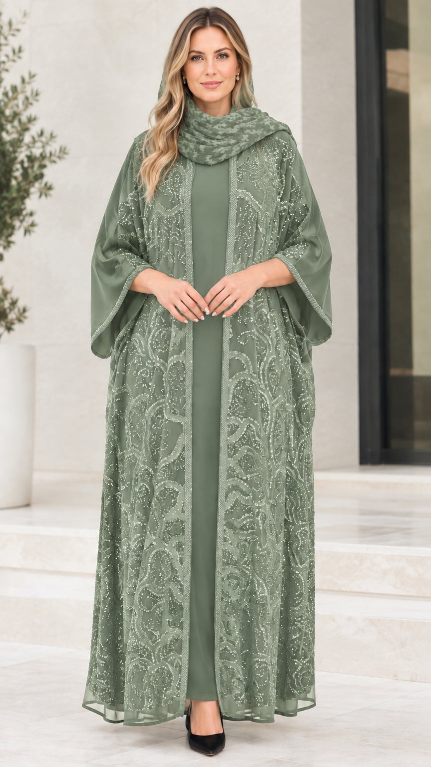 Model wearing sage green sequin embroidered abaya set with matching dress and hijab