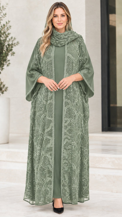 Model wearing sage green sequin embroidered abaya set with matching dress and hijab