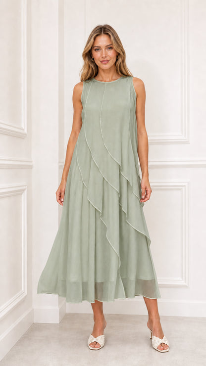 Model wearing sage green sleeveless tiered chiffon midi dress