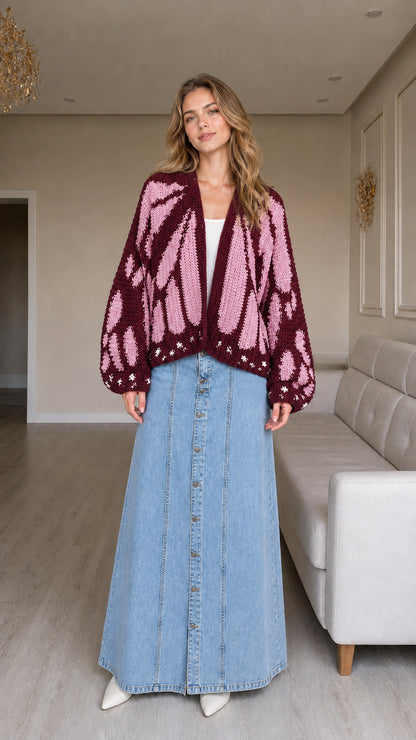 Model wearing burgundy and mauve butterfly wing knit cardigan