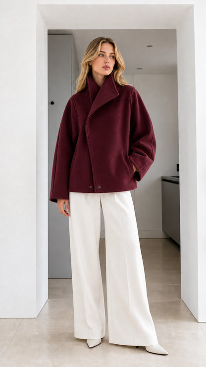 Full-length view of model wearing rich burgundy high-neck short jacket