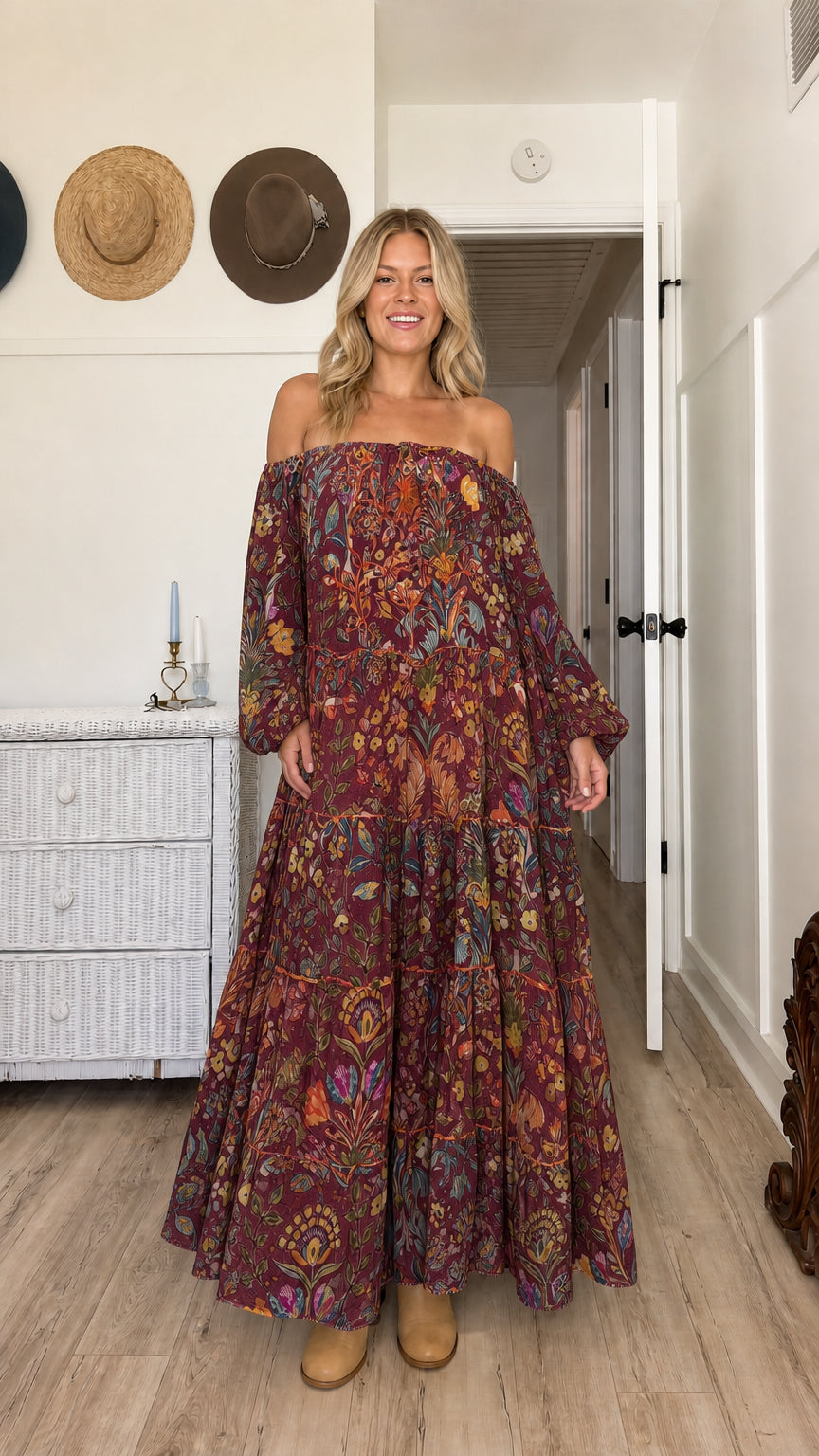 Model wearing burgundy floral off-the-shoulder tiered maxi dress