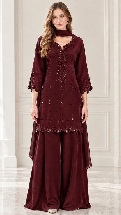 Full-length front view of burgundy maroon embroidered kurti and wide-leg trousers suit set