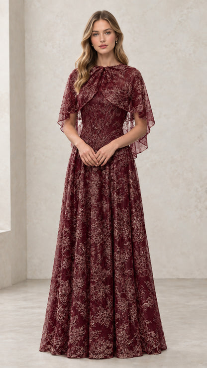 Woman wearing Burgundy embroidered lace capelet evening gown