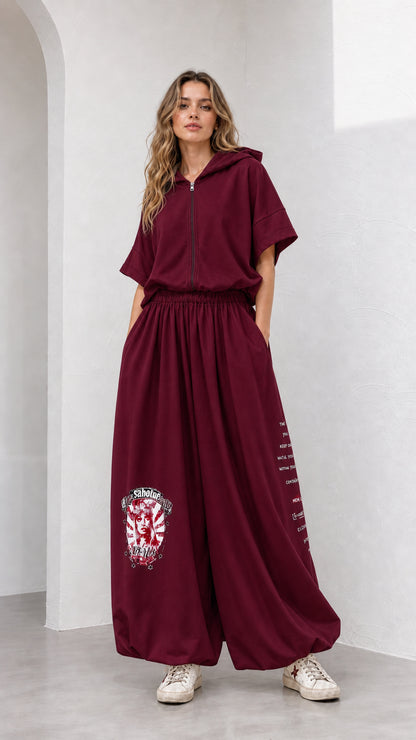 Model wearing burgundy wine red short-sleeve hooded top and wide-leg pants set