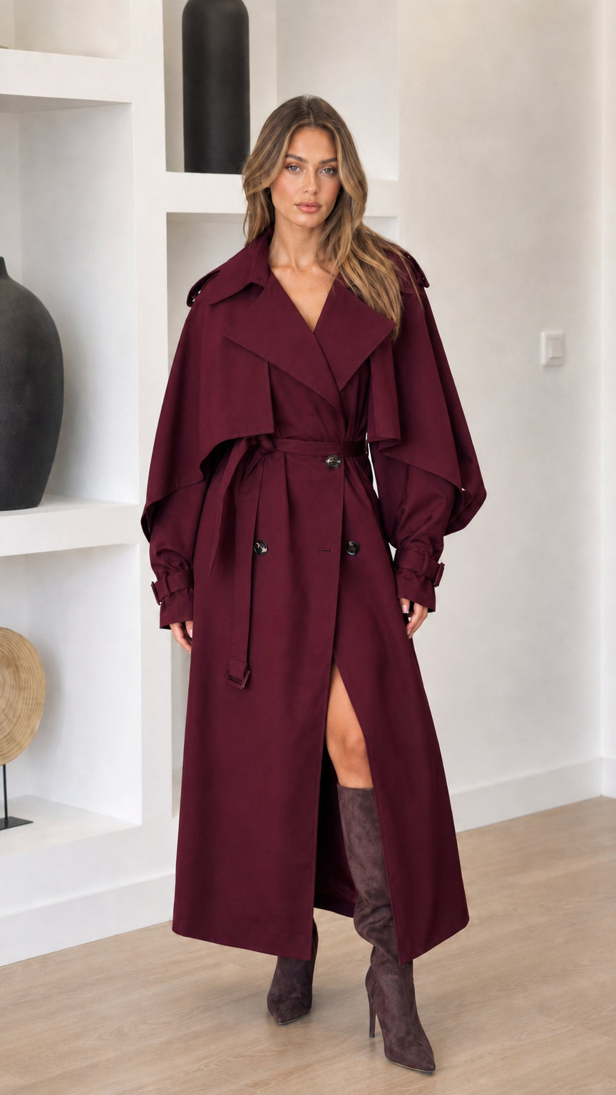 Burgundy women's belted midi trench coat shown from the front
