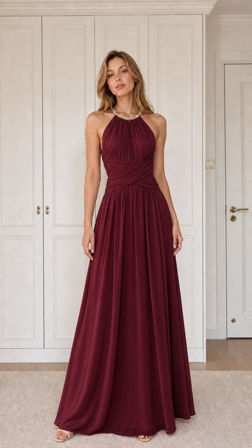 Front view of woman wearing burgundy wine halter pleated chiffon maxi dress