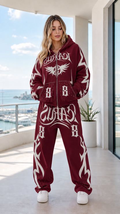 Full body front view of burgundy graphic zip-up hoodie and sweatpants set