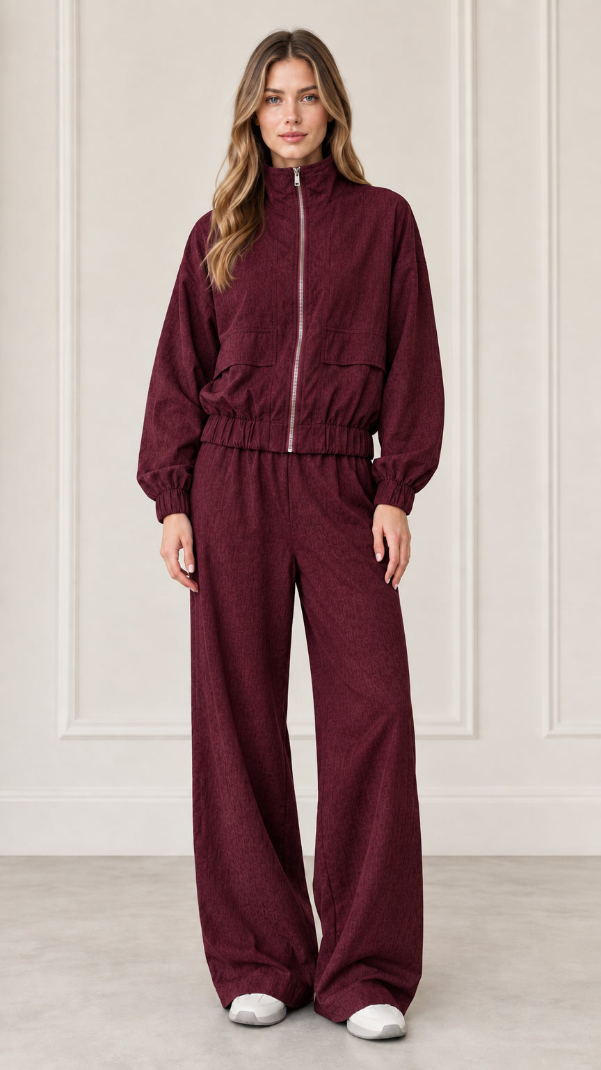 Front full-length view of woman wearing Burgundy zip-up jacket and wide-leg pants set
