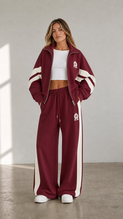 Burgundy red women's two-piece tracksuit set with white contrast stripe details